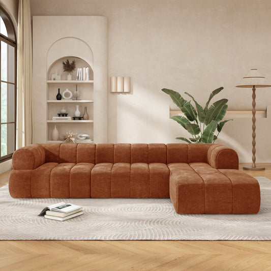 An orange modern sectional sofa in a living room setting.