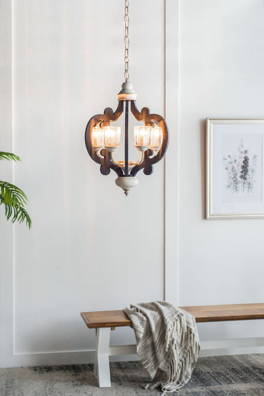 Wooden chandelier with four lights, cream-colored finish, hanging from a chain, above a wooden bench with a textile draped over it.