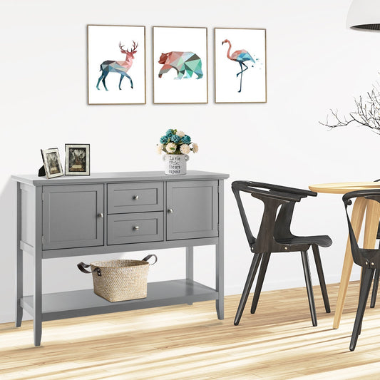 Wooden sideboard buffet console table with drawers and open shelves, placed in a dining area with framed artwork on the wall.