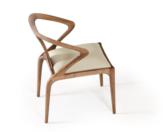 31 inches leatherette and wood dining chair with curved design, dark wood frame, light cream seat and backrest, simple setting.