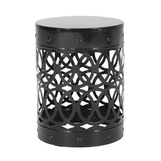 Round black metal side table with intricate geometric cutout pattern