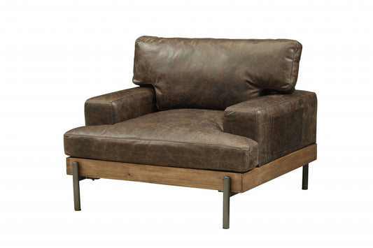 A Distressed Chocolate Brown High Grade Leather Chair with a wooden base and metal legs, set against a white background.