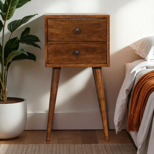 Small wooden nightstand with 2 drawers, chestnut finish, in a bedroom setting.