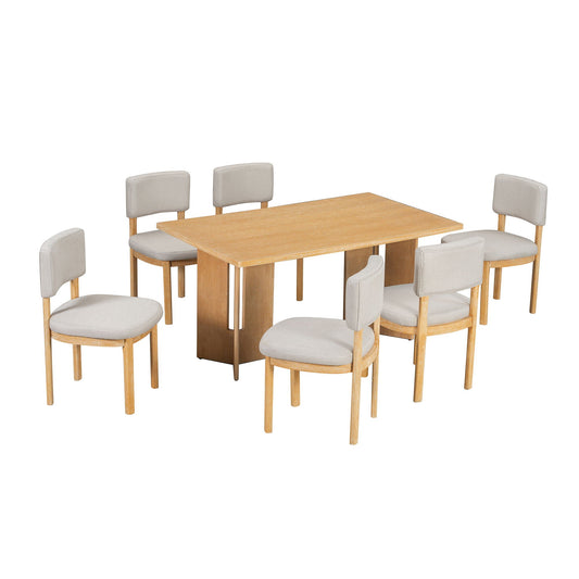 Rectangular table with cutout legs and upholstered chairs in cream color. Simple design.