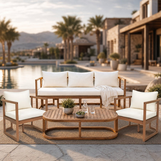 Teak sofa with white cushions and modern design on a patio near a pool and palm trees.