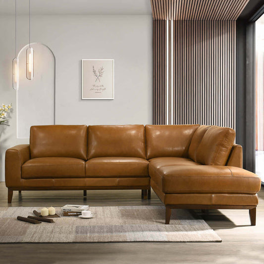 A tan leather sectional sofa with contemporary design, placed in a modern living room setting with wooden slats on the wall.
