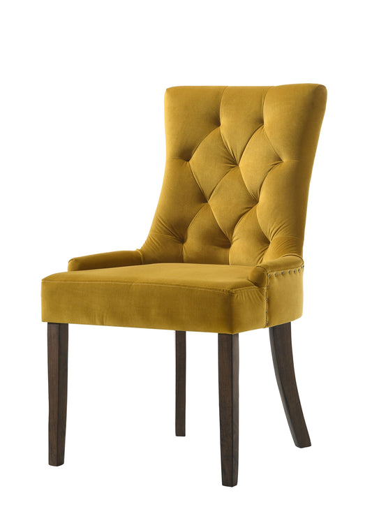 Mustard yellow velvet upholstered dining chair with tufted detailing and wooden legs