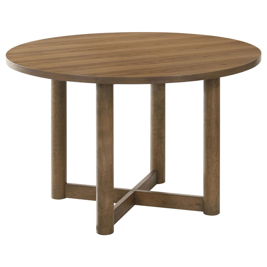 Round wooden dining table with four vertical legs and a simple X-shaped brace under for support.