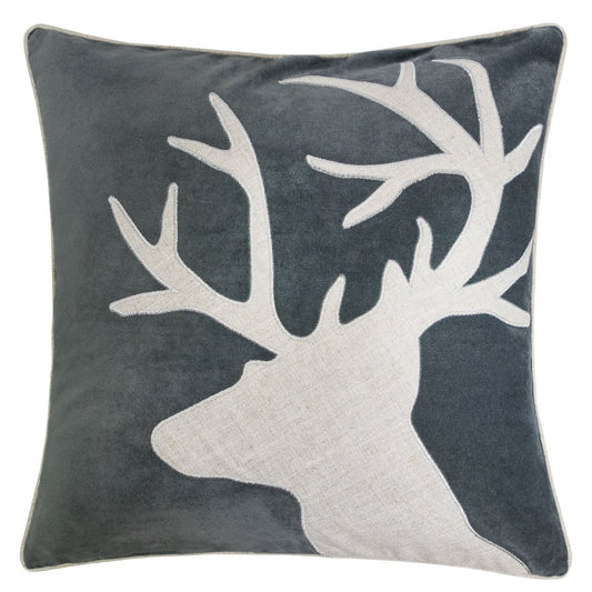 Velvet pillow with embroidered reindeer silhouette in white on a dark gray background