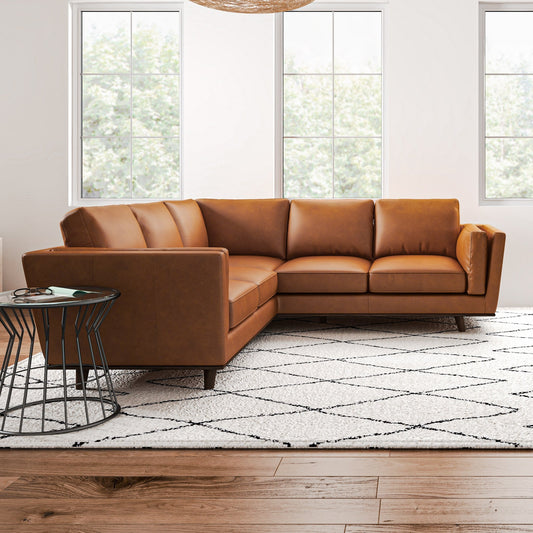 Erman Leather Sectional Sofa, tan leather, light wood floor, geometric rug, window backdrop