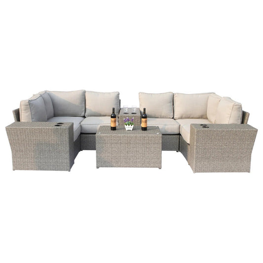 Modern outdoor wicker seating group with cushions in neutral tones, displayed in a clean, isolated setting.