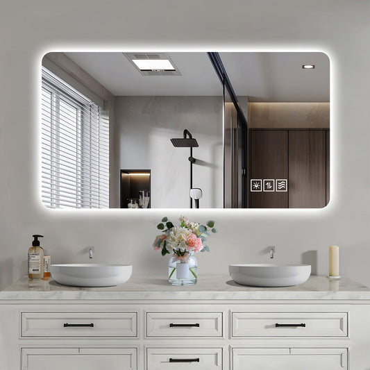 Wall Mounted LED Lighting Mirror - 24" x 48" with a light-up display above a dual sink vanity, featuring a white countertop and drawers.