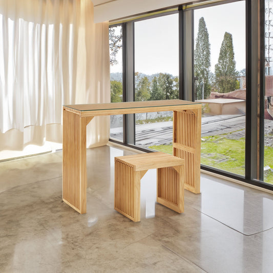 Slat-style pine buffet set with glass top in a modern room overlooking greenery