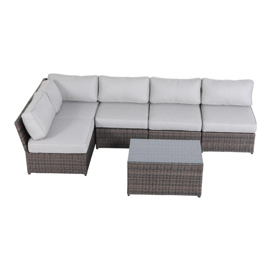A fully assembled 4-person outdoor wicker seating set with light grey cushions and a dark wicker finish, including a coffee table with a greyish-blue fabric top.