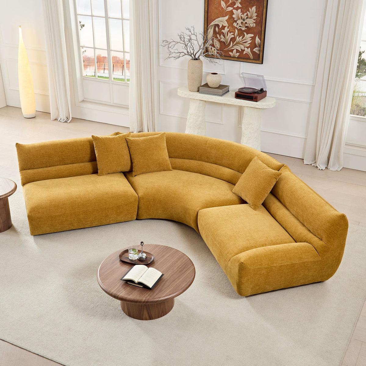 Yellow modular curved sectional sofa in a modern living room setting.
