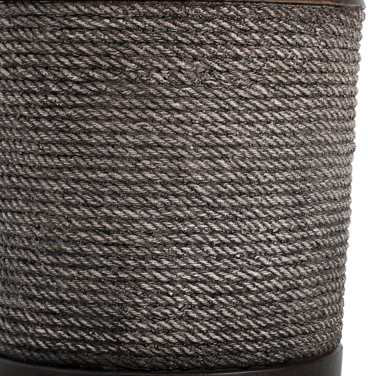 Close-up of dark brown braided cord material.