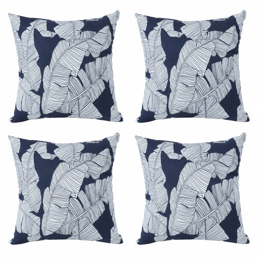 Four navy blue outdoor pillow covers with white leaf print, 18x18 inches each, on a white background