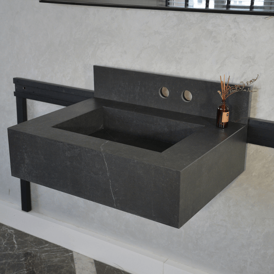Dark grey Dekton Laos sink with two circular taps in a bathroom setting