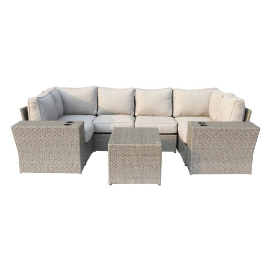 A corner wicker patio sofa set with cushions, in neutral tones.