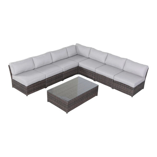 U-shaped outdoor wicker seating set with light grey cushions and table, placed on a plain background.