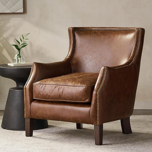 Vintage-style brown leather sofa with nailhead trim and wooden legs