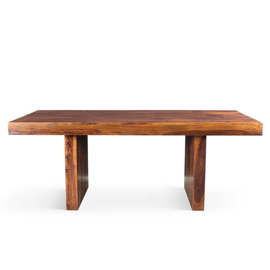 A rectangular sheesham wood dining table with a natural finish and a smooth surface.