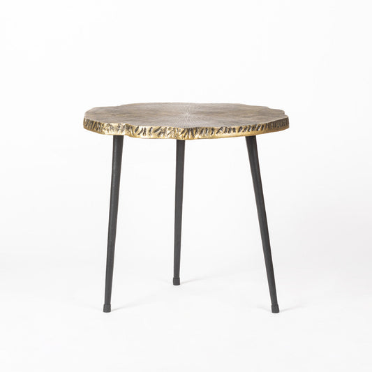 Rustic table with a golden finish and black legs.