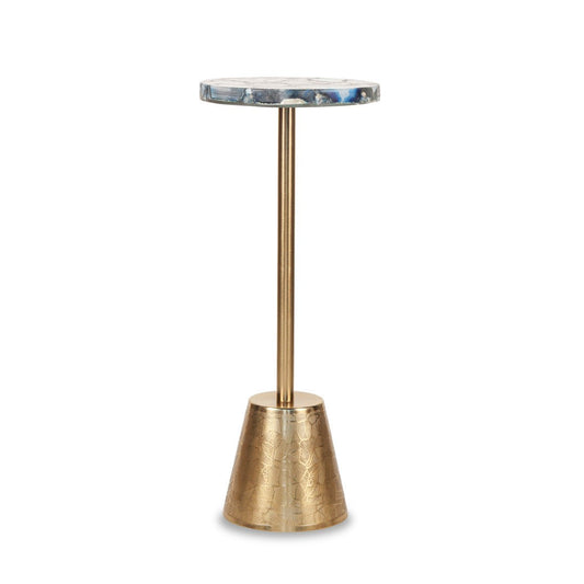 A tall, slender table with a textured gold base and a circular top featuring a blue and white pattern.