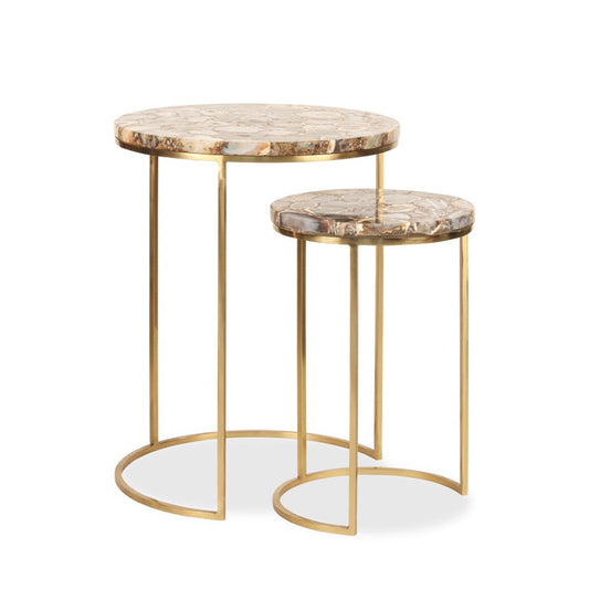 Nested round tables with marble tops and brass legs, with varying depths