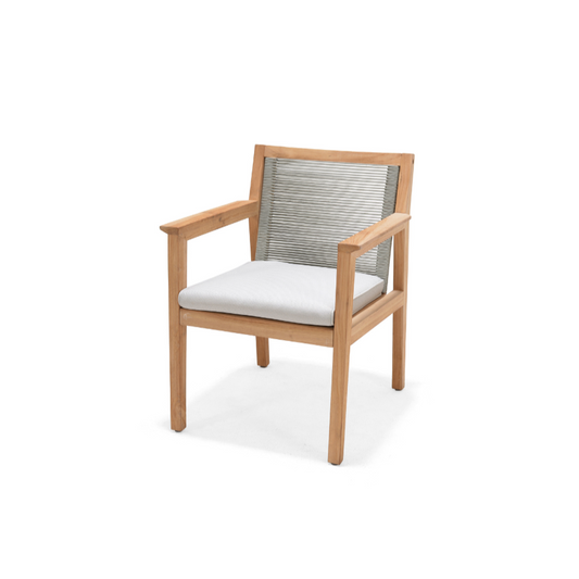 A simple armchair with teakwood legs, a woven back, and a light gray cushion.