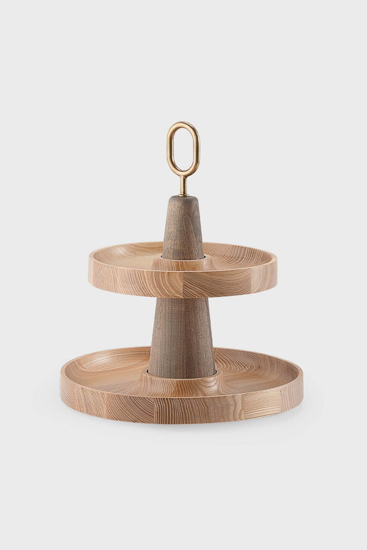 Two-tiered serving stand with wood texture and metallic loop on top, light wood color, plain background.