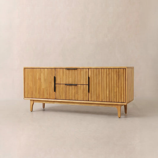 Rectangular wooden storage bench with vertical slats and simple black handles, positioned against a light wall.