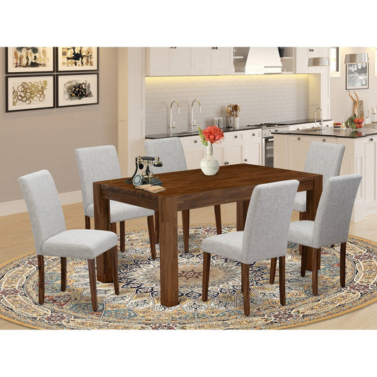 Wooden dining table with six upholstered chairs on vintage rug in dining area
