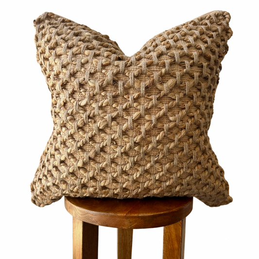 Tanah Pillow Cover, woven, beige, on stool.
