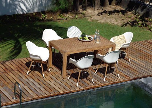 Rinjani Rectangular Table with 6 Chamonix Arm Chairs, beige finish, white and beige seats, wooden outdoor deck, greenery background