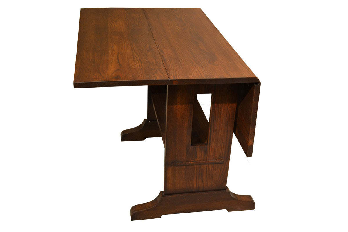 Mission solid oak drop leaf dining table in walnut finish, angled view from above