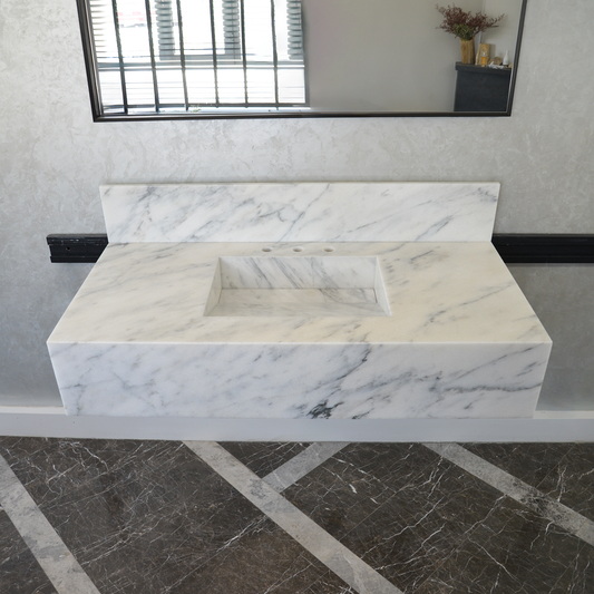 Calacatta Viola White Marble Handcrafted Sink - Sculptural Design on black marble floor