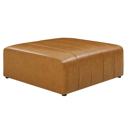 Caramel vegan leather ottoman with vertical stitching on a plain background