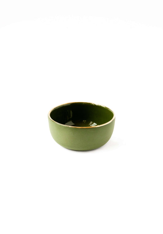 A small, glossy green bowl with a gold rim on a white background.