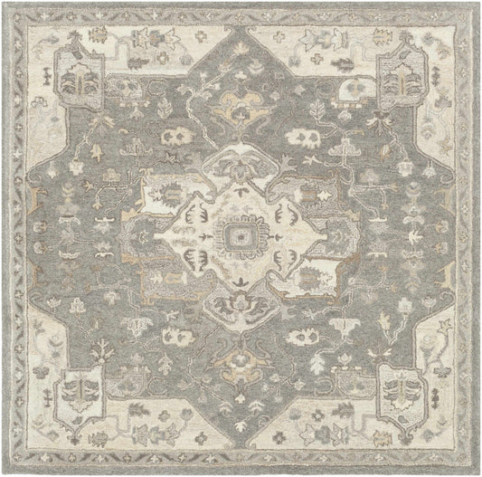 Hand tufted taupe wool rug with intricate geometric and floral patterns in gray and beige tones.