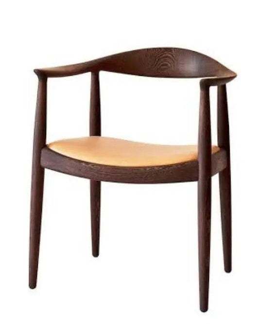 Scandinavian style chair with dark wooden legs and curved back in a neutral setting