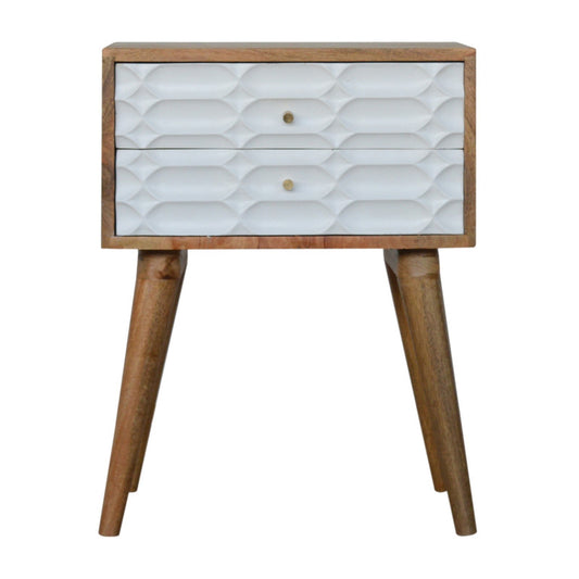 Capsule Carved Bedside with wooden legs, white textured drawers, light wood finish, displayed on a plain background.