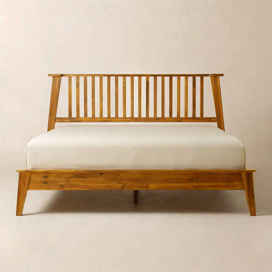 Solid wood bed frame with slatted headboard, light brown finish, white mattress on plain background
