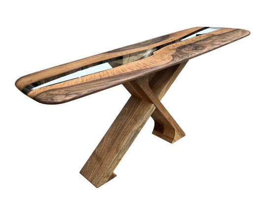 Handcrafted solid walnut console table with glass top, natural finish and angular legs.