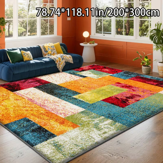 Multi-colored, geometric patterned plush rug on wooden floor, blue couch and windows in orange walls visible.