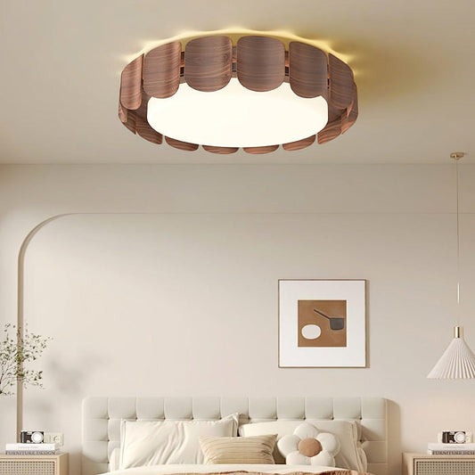 Modern wabi-sabi flush ceiling light with a scalloped ring of rust-brown panels around a glowing white diffuser