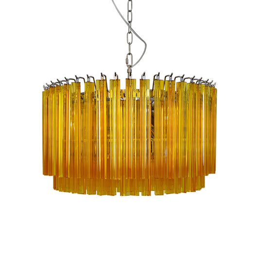 Murano round prisms amber chandelier with glass prisms hanging from a metal chain against a neutral background;