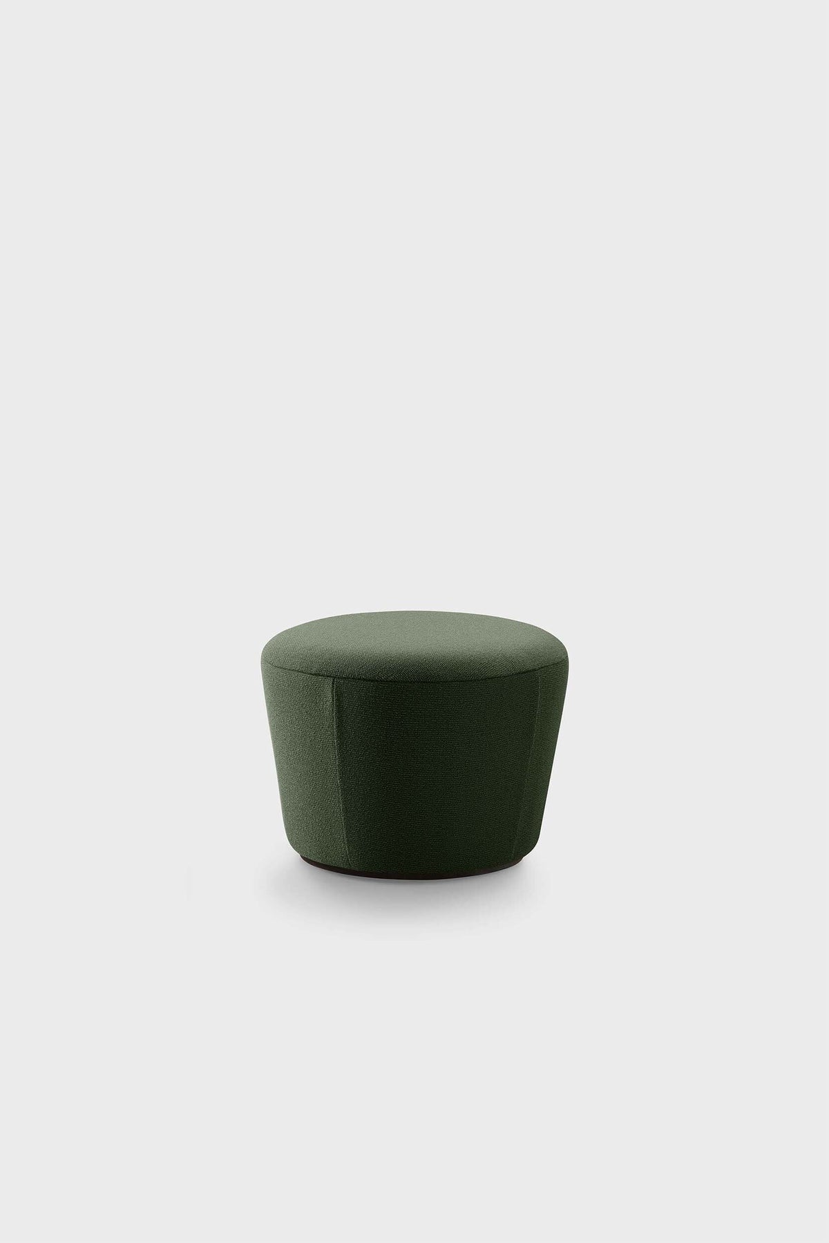 A dark green upholstered pouf with a simple, round design sitting on a plain white background.