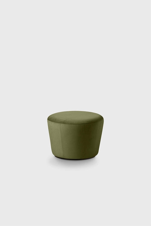 Round green pouf with a smooth fabric cover on a plain background