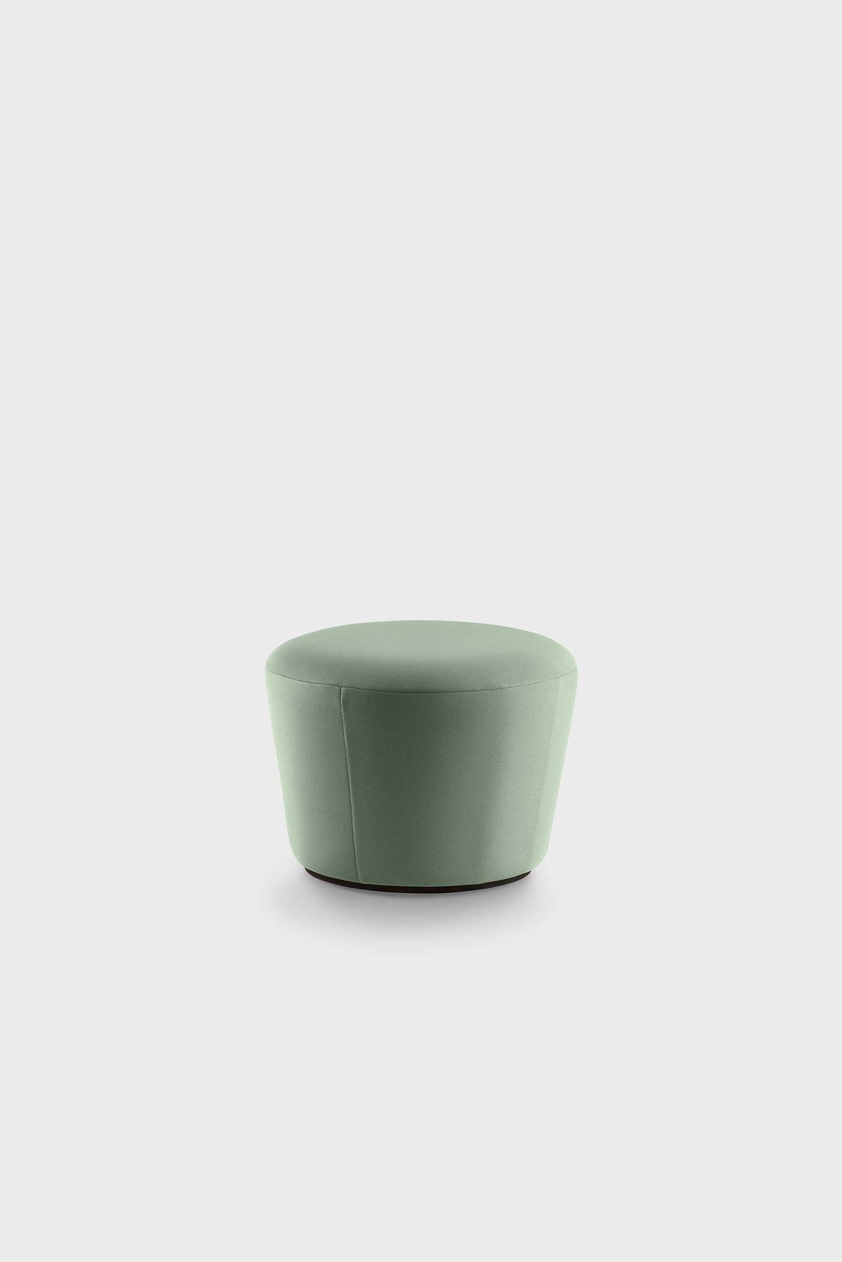 Oval, muted green upholstered pouf on plain background